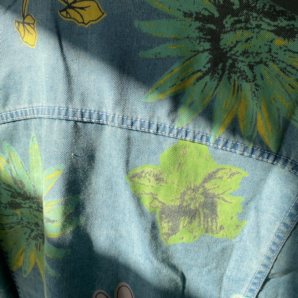 Painted floral jean jacket. New/barely used from Girl Tribe Boutique